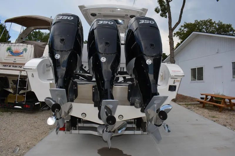  Yacht Photos Pics 2018 Fountain 38 SCX boat with triple 350 horsepower engines, docked outdoors.