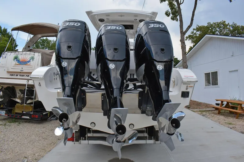  Yacht Photos Pics 2018 Fountain 38 SCX boat with triple 350 horsepower engines, docked outdoors.