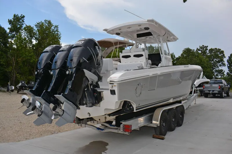  Yacht Photos Pics 2018 Fountain 38 SCX boat with triple Mercury outboard engines on a trailer.