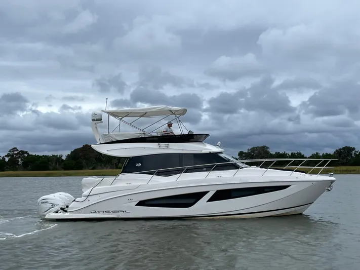 Grateful Yacht Photos Pics 2022 Regal 42 FXO yacht cruising on a cloudy day.