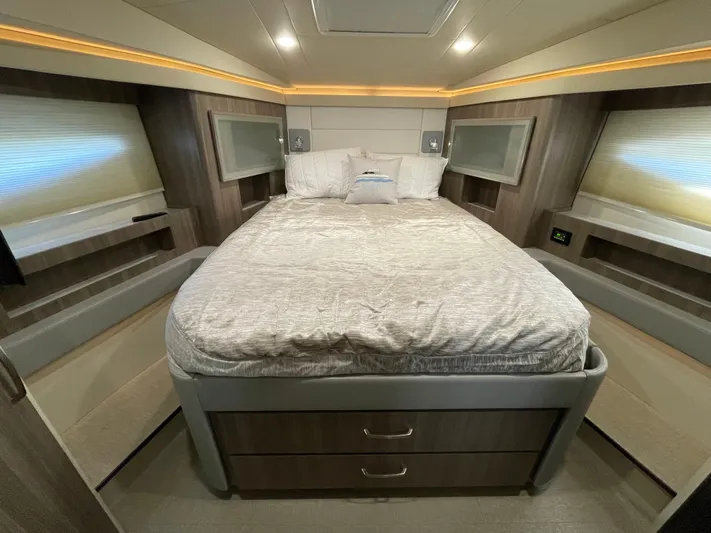 Grateful Yacht Photos Pics Luxurious bedroom interior of 2022 Regal 42 FXO yacht with modern design.