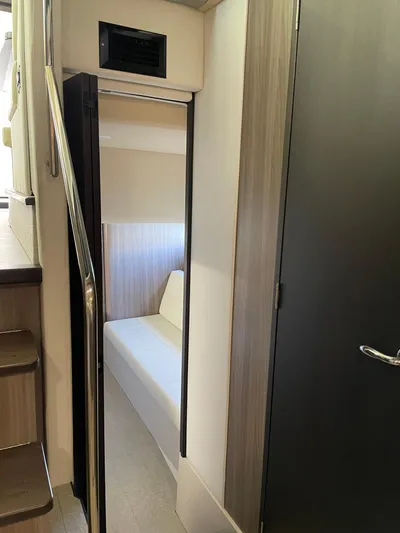 Grateful Yacht Photos Pics Interior of 2022 Regal 42 FXO yacht, featuring a modern cabin and sleek design.