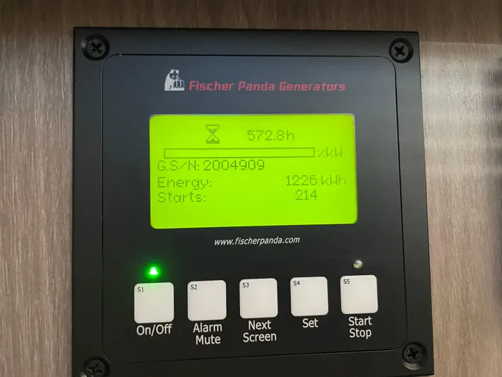 Grateful Yacht Photos Pics Fischer Panda generator display on Regal 42 FXO, showing 572.8 hours and 1226 kWh energy usage.