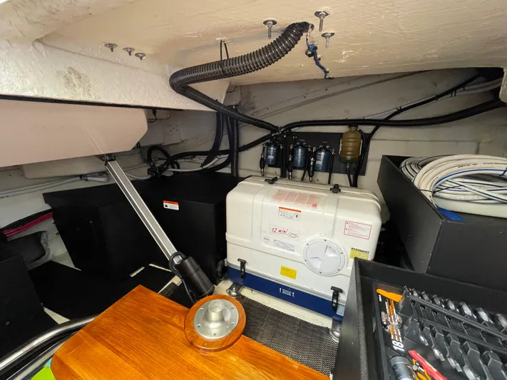 Grateful Yacht Photos Pics Engine room of 2022 Regal 42 FXO boat with mechanical components and wiring.