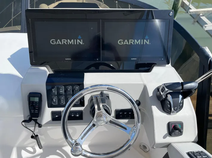 Grateful Yacht Photos Pics 2022 Regal 42 FXO helm with dual Garmin displays and controls.
