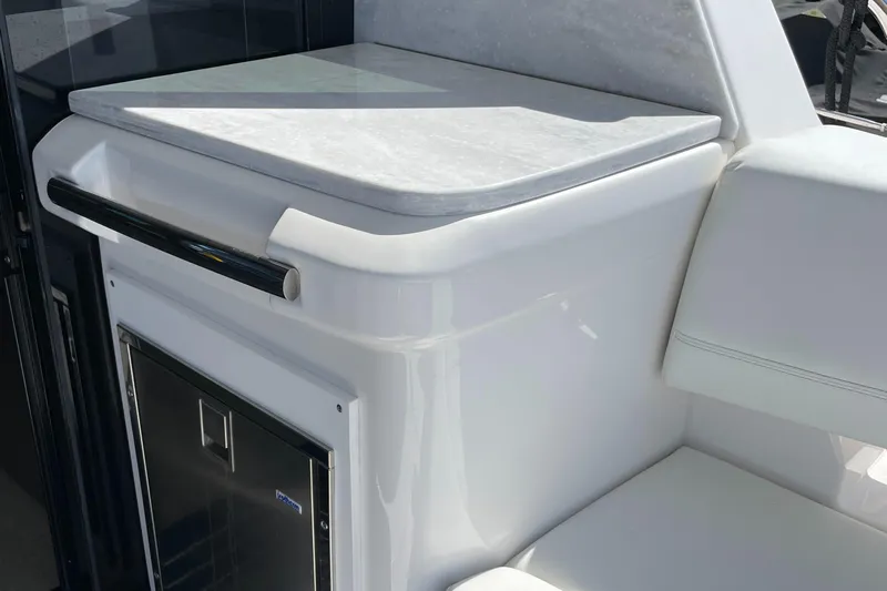 Grateful Yacht Photos Pics 2022 Regal 42 FXO yacht interior with sleek white cabinetry and countertop.