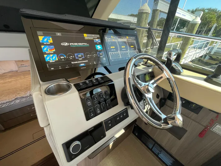 Grateful Yacht Photos Pics 2022 Regal 42 FXO helm with modern controls and touchscreen displays.