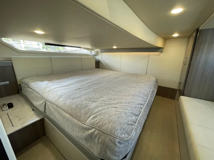 Grateful Yacht Photos Pics Luxurious cabin interior of 2022 Regal 42 FXO yacht with spacious bed.
