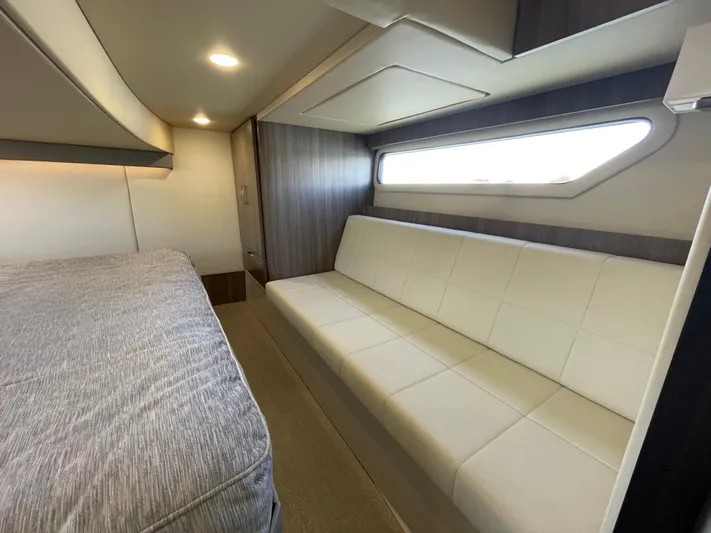 Grateful Yacht Photos Pics Interior of 2022 Regal 42 FXO yacht with modern seating and bed.