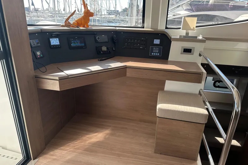  Yacht Photos Pics Helm station of 2022 Bali 4.6 OPEN SPACE yacht with modern controls and seating.