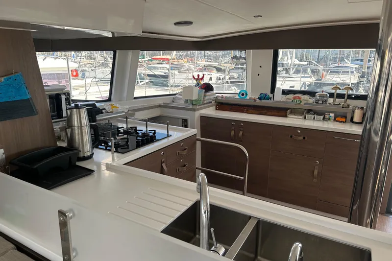  Yacht Photos Pics Modern kitchen interior of 2022 Bali 4.6 OPEN SPACE yacht with marina view.