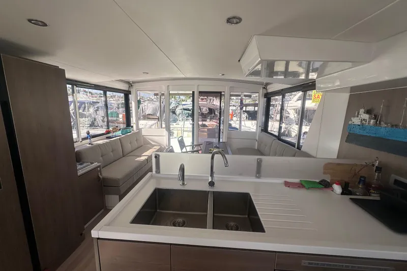  Yacht Photos Pics Interior of 2022 Bali 4.6 OPEN SPACE yacht, featuring modern kitchen and seating area.