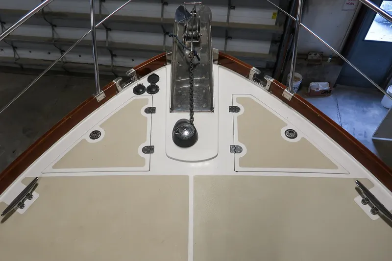 Blue Tang Yacht Photos Pics Bow view of 2007 Grand Banks 39 Eastbay SX yacht in a garage setting.