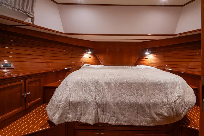 Blue Tang Yacht Photos Pics Luxurious cabin interior of 2007 Grand Banks 39 Eastbay SX with elegant wood paneling.