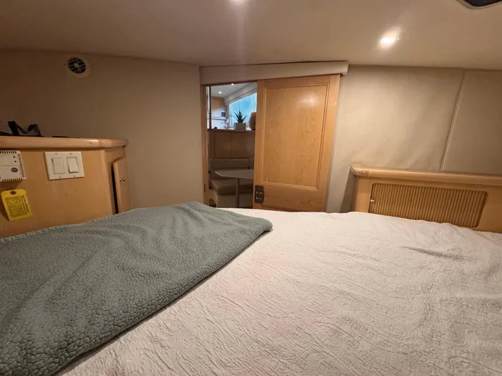  Yacht Photos Pics Interior of 1998 Carver 405 Aft Cabin with cozy bed and wooden accents.