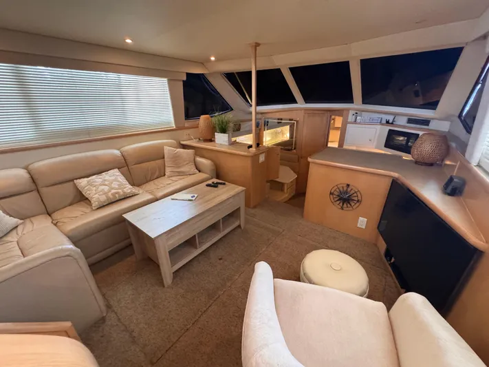  Yacht Photos Pics Luxurious interior of 1998 Carver 405 Aft Cabin yacht with comfortable seating and modern amenities.