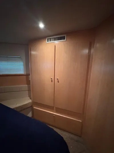  Yacht Photos Pics 1998 Carver 405 Aft Cabin interior with wooden cabinetry and seating area.