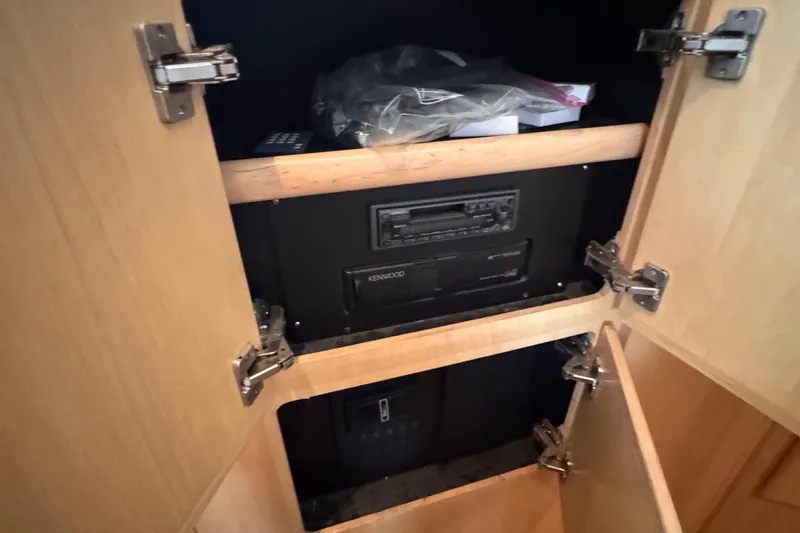  Yacht Photos Pics 1998 Carver 405 Aft Cabin interior cabinet with Kenwood stereo system.