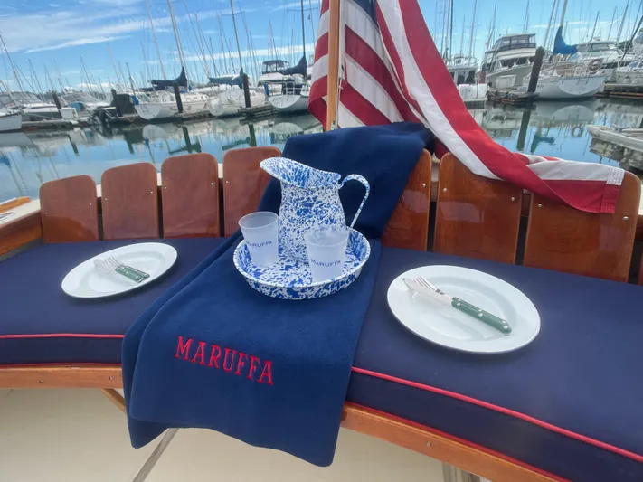 Maruffa Yacht Photos Pics Elegant setup on 1980 Dyer 29 boat with American flag and marina view.