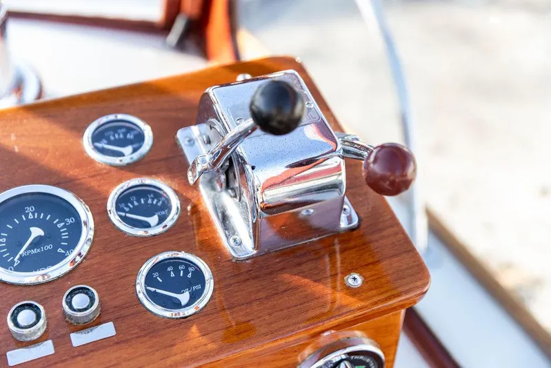 Maruffa Yacht Photos Pics Control panel of a 1980 Dyer 29 boat with gauges and throttle levers.