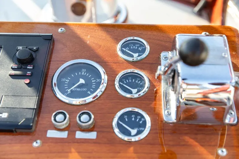 Maruffa Yacht Photos Pics Control panel of a 1980 Dyer 29 boat with gauges and throttle lever.