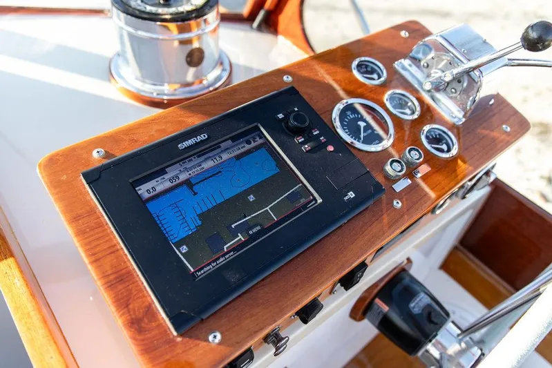 Maruffa Yacht Photos Pics Control panel of a 1980 Dyer 29 boat with navigation display and gauges.