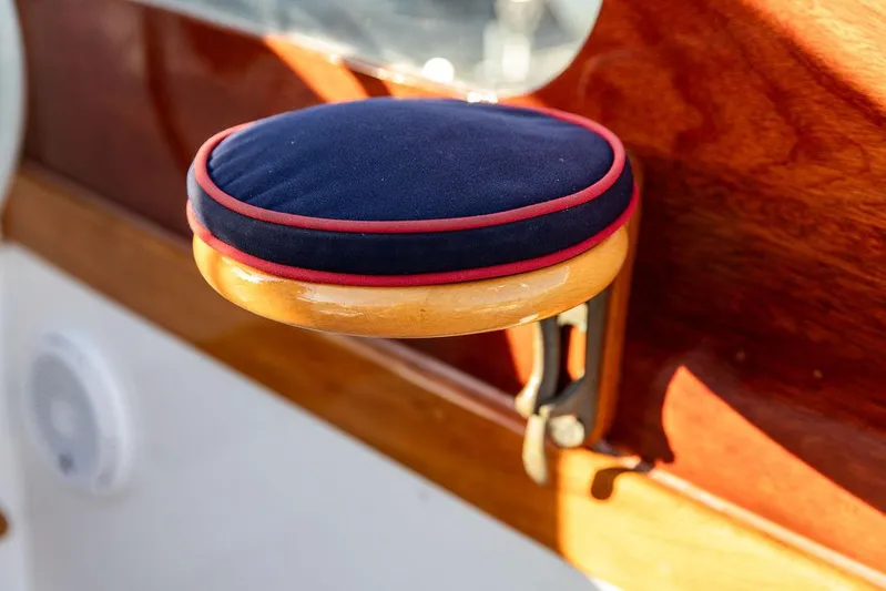 Maruffa Yacht Photos Pics Cushioned armrest on 1980 Dyer 29 boat, featuring wood and fabric design.
