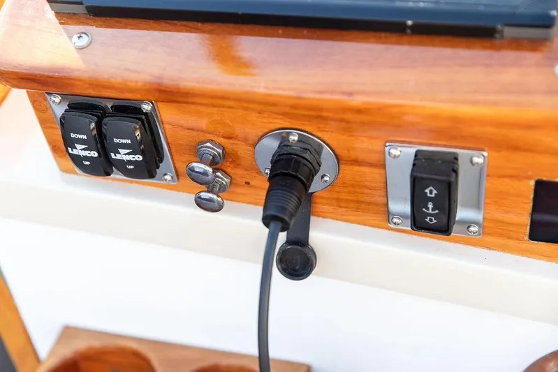 Maruffa Yacht Photos Pics Control panel on a 1980 Dyer 29 boat with switches and a cable connection.