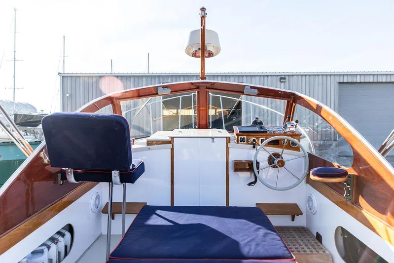 Maruffa Yacht Photos Pics 1980 Dyer 29 boat interior with wooden accents and steering wheel.