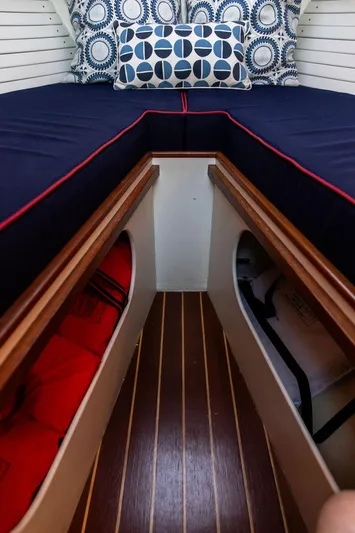 Maruffa Yacht Photos Pics Cozy cabin interior of a 1980 Dyer 29 boat with nautical-themed bedding.