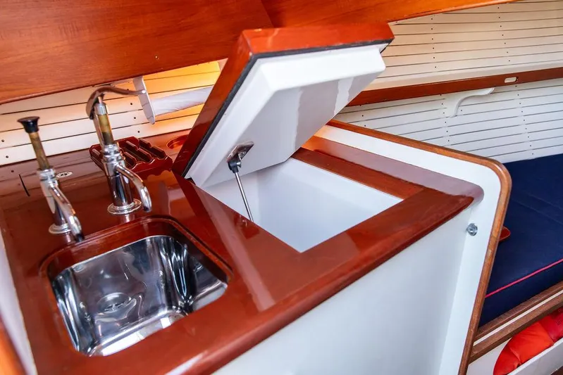 Maruffa Yacht Photos Pics 1980 Dyer 29 yacht interior with sink and storage compartment.