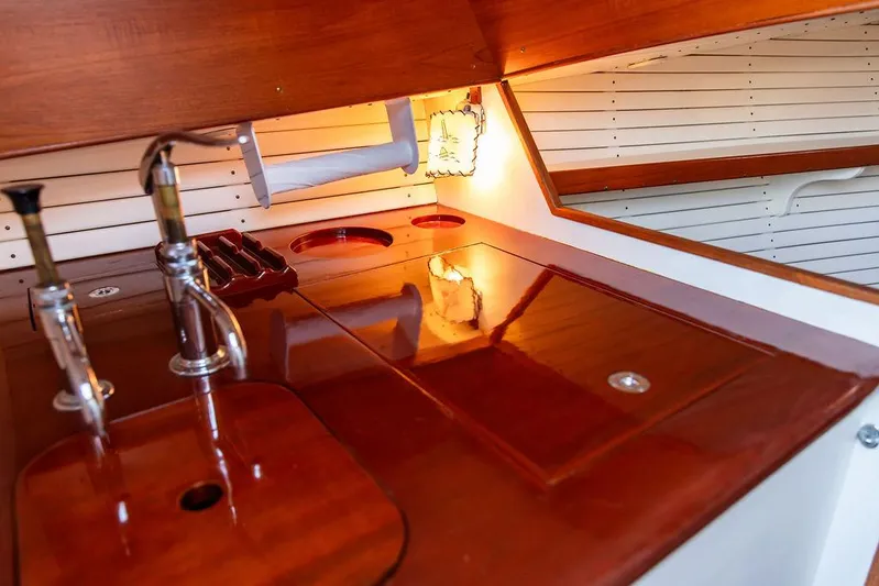 Maruffa Yacht Photos Pics Interior of 1980 Dyer 29 boat with wooden countertop and sink.