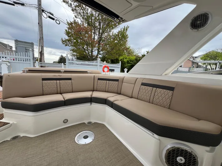 Knot On Call Yacht Photos Pics Luxurious seating area on a 2018 Sea Ray 310 SLX boat, featuring beige upholstery.