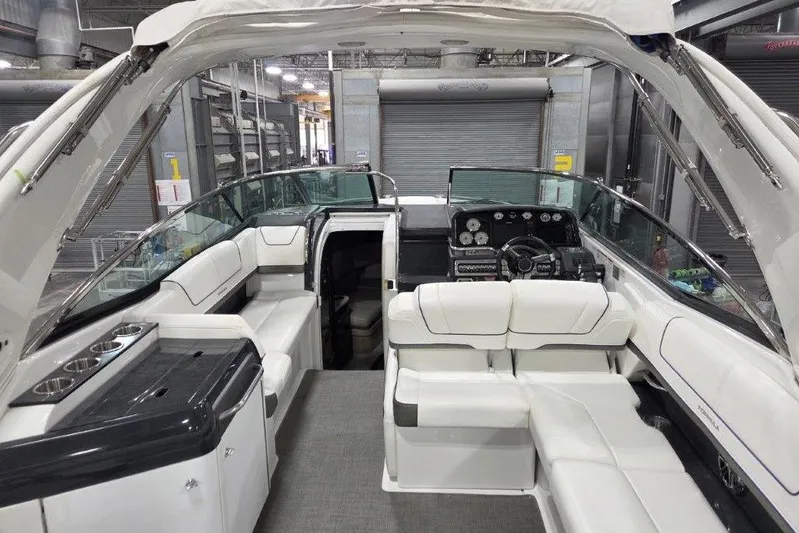  Yacht Photos Pics 2019 Formula 310 Sun Sport boat interior with white seating and modern dashboard.
