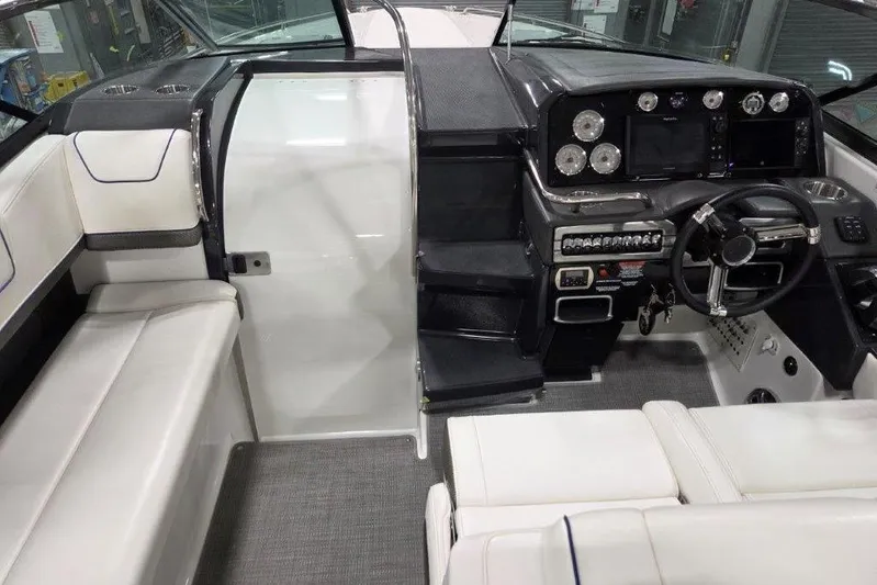  Yacht Photos Pics 2019 Formula 310 Sun Sport boat interior with modern dashboard and seating.