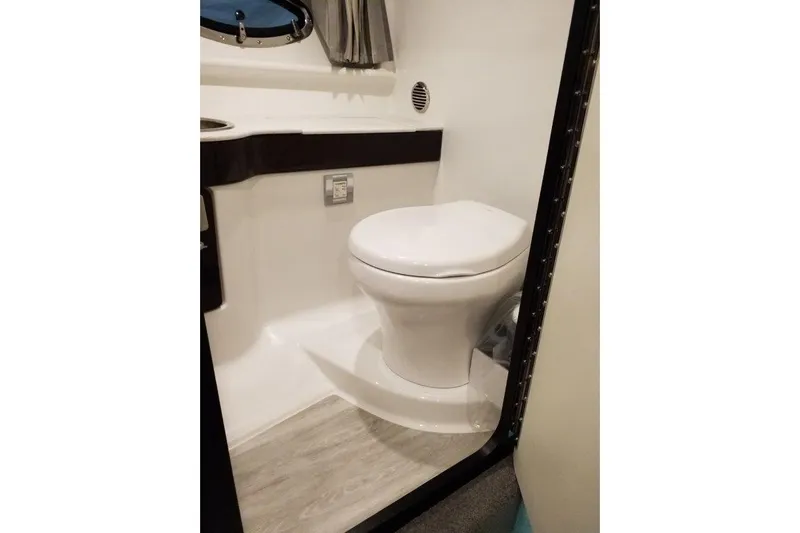 Yacht Photos Pics 2019 Formula 310 Sun Sport boat bathroom with modern toilet and sleek design.