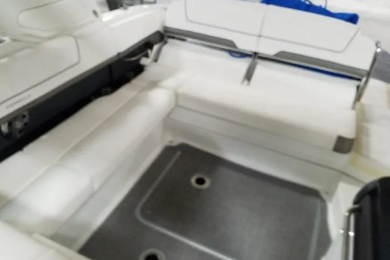  Yacht Photos Pics 2019 Formula 310 Sun Sport boat interior with white seating and gray flooring.