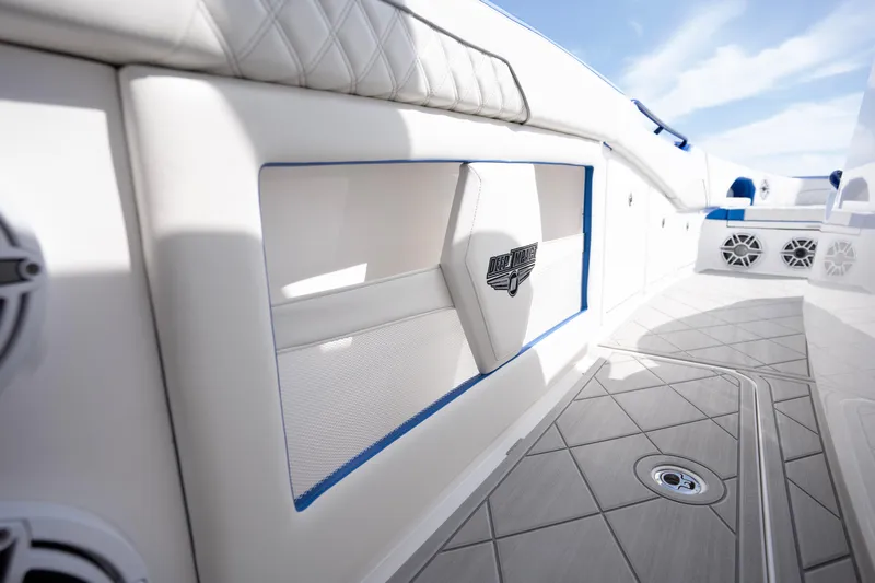  Yacht Photos Pics 2024 Deep Impact 399 Sport boat interior with sleek white and blue design.
