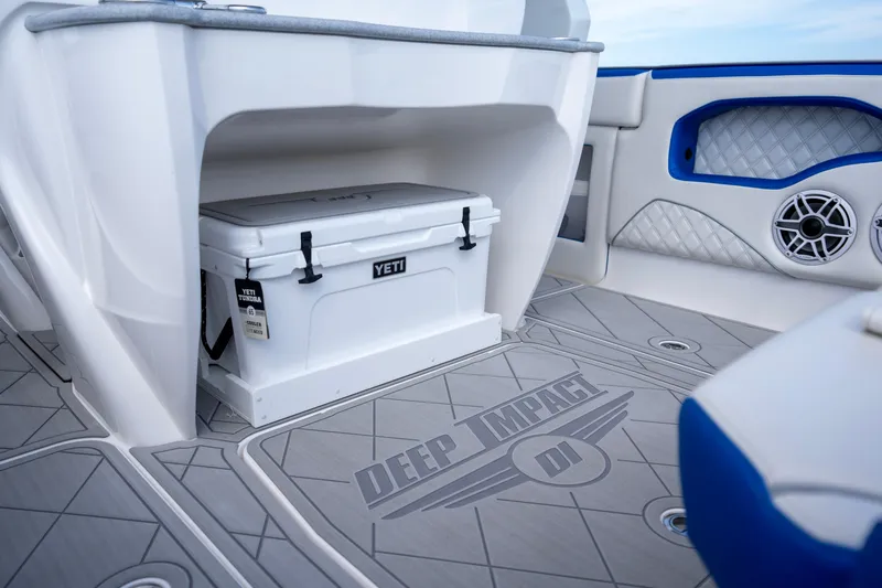  Yacht Photos Pics 2024 Deep Impact 399 Sport boat interior with Yeti cooler and stylish flooring design.