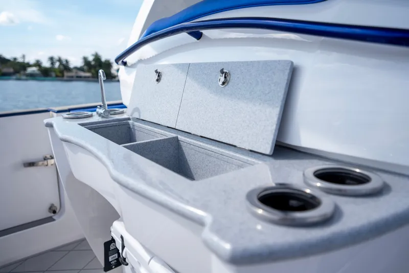  Yacht Photos Pics 2024 Deep Impact 399 Sport boat interior with sink and storage compartments.