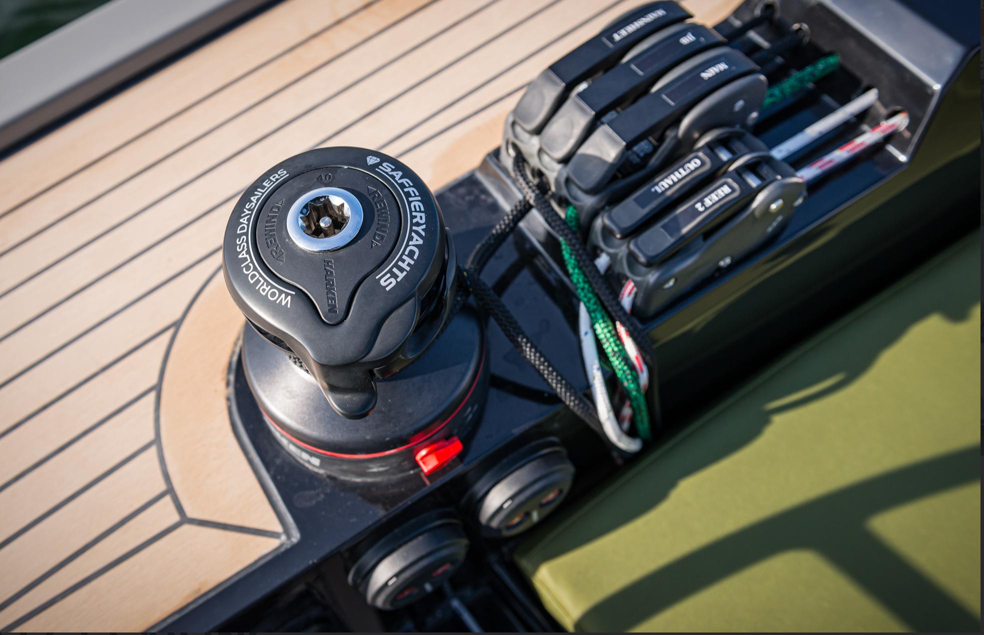 Close-up of 2023 Saffier 33 Life yacht deck with winch and control lines.