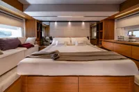 Luxurious interior of 2026 Solaris Power 60 yacht with elegant bedroom design.