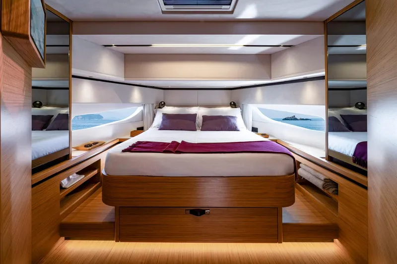  Yacht Photos Pics Luxurious interior of 2026 Solaris Power 60 yacht with elegant wood finishes and scenic windows.