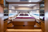 Luxurious interior of 2026 Solaris Power 60 yacht with elegant wood finishes and scenic windows.