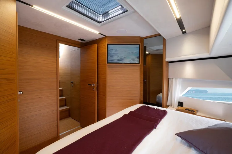  Yacht Photos Pics Luxurious interior of 2026 Solaris Power 60 yacht with modern wood finish and ocean view.