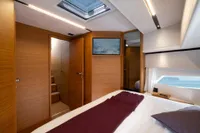 Luxurious interior of 2026 Solaris Power 60 yacht with modern wood finish and ocean view.