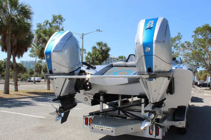  Yacht Photos Pics 2025 Fountain 34 Thundercat boat with dual engines parked outdoors.
