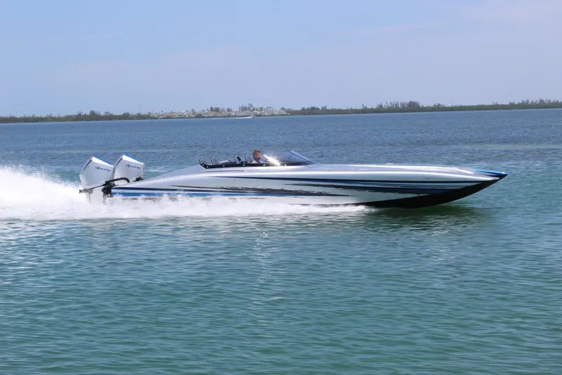  Yacht Photos Pics 2025 Fountain 34 Thundercat speedboat cruising on open water.