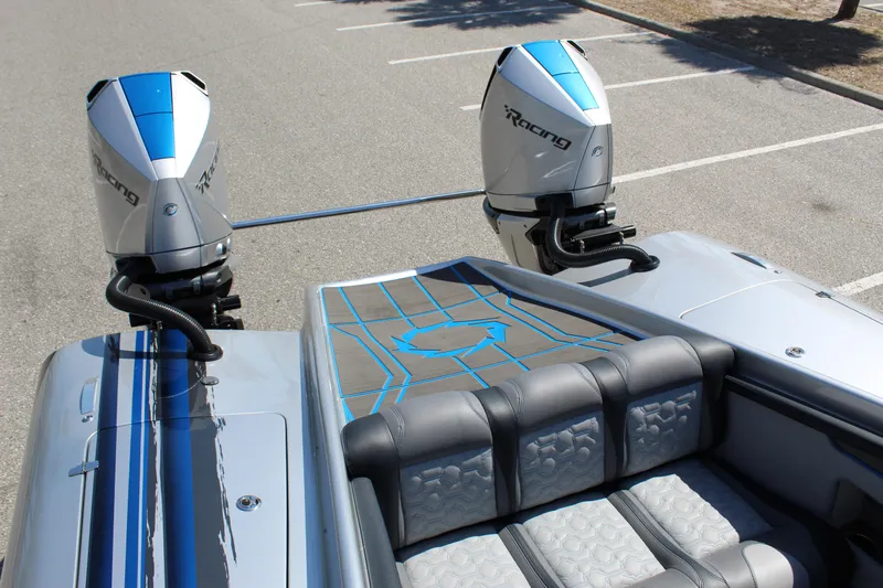  Yacht Photos Pics 2025 Fountain 34 Thundercat boat with dual racing engines and sleek seating design.