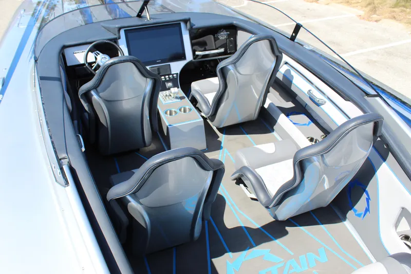  Yacht Photos Pics 2025 Fountain 34 Thundercat interior with sleek seating and modern dashboard design.